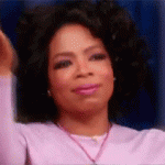 Oprah Winfrey Clasps Hands