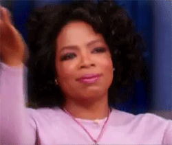Oprah Winfrey Clasps Hands